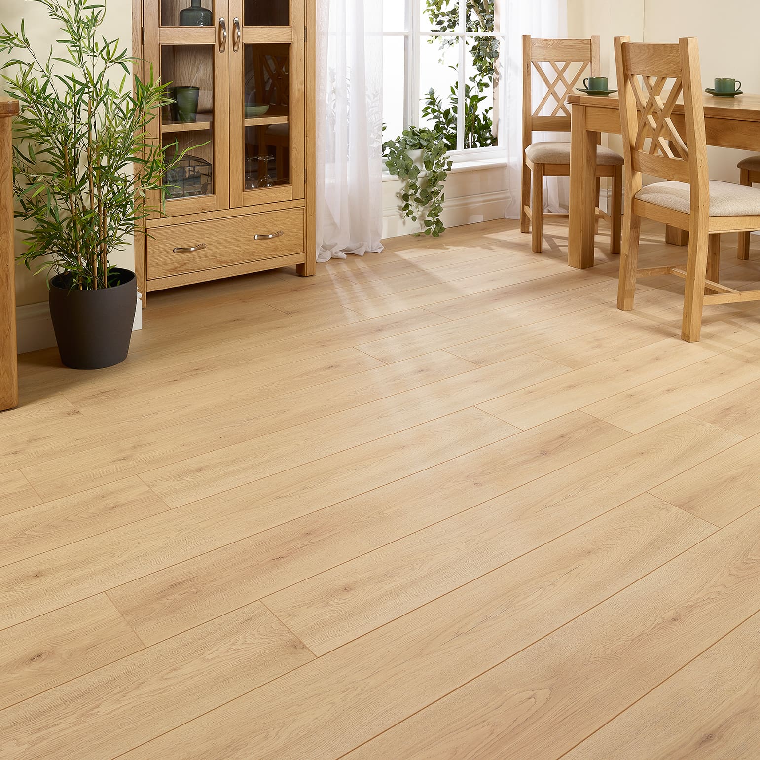 Toledo Oak 12mm 4V Groove Laminate Flooring with natural oak tones and textured surface.